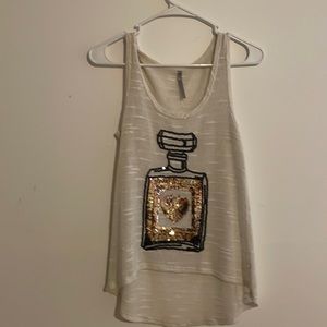 This tank top has gold and black sequins